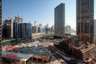 an aerial view of a city with tall buildings at Brand New with Burj Khalifa View in Dubai