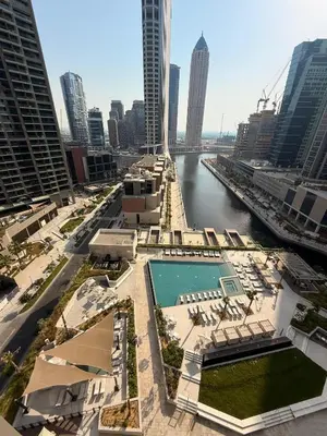 a view of a river in a city with buildings at Brand New with Burj Khalifa View in Dubai