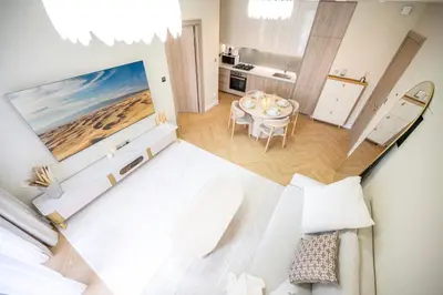 an overhead view of a bedroom with a dining room at Brand New with Burj Khalifa View in Dubai