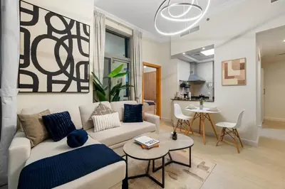 a living room with a couch and a table at Entire Apartment in Dubai Marina in Dubai