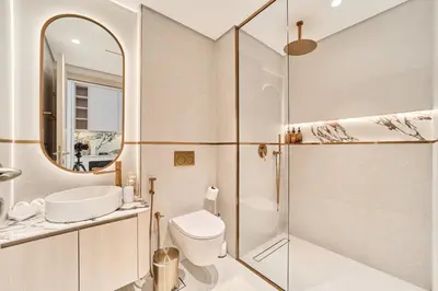a bathroom with a sink toilet and a shower at Bright Studio Retreat in Floarea Residence Arjan in Dubai