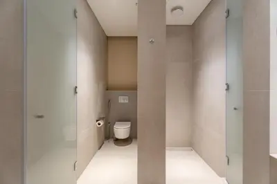 a small bathroom with a toilet in a room at GuestReady - 1BR Near Dubai Mall | Downtown Stay in Dubai