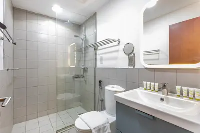 a bathroom with a shower and a toilet and a sink at Bahar 1, JBR - 2 Bedroom Apartment - Allsopp & Allsopp in Dubai