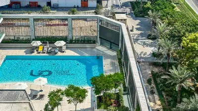 an overhead view of a swimming pool at a hotel at Modern & Cozy 1BR in Business Bay with Pool View - 10AB05 in Dubai