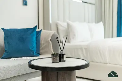 a coffee table in a living room with a couch at Peaceful Studio in Opalz by Danube by BMS in Dubai