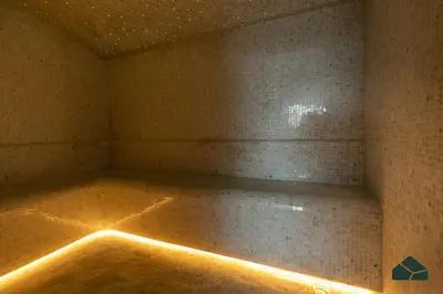 an empty room with a brick wall and lights at Peaceful Studio in Opalz by Danube by BMS in Dubai