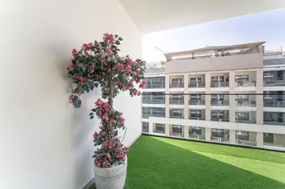 an empty building with a potted plant on the wall at HAVN - Spacious One Bedroom in Binghatti Creek in Dubai