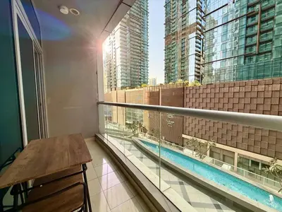 a balcony with a table and a view of a building at Cozy apartment in Dubai Marina - Torch Tower in Dubai