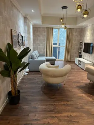 a living room with a couch and a table at Fabulous 1 bed apartment within walking distance to Dubai mail and Burj Khalifa in Dubai