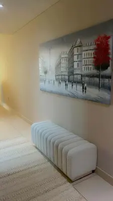a bedroom with a painting on the wall and a mattress at Cozy private master bedroom for solo female in shared home in Dubai