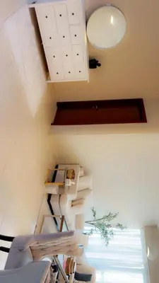 a room with a staircase with white cabinets at Cozy private master bedroom for solo female in shared home in Dubai