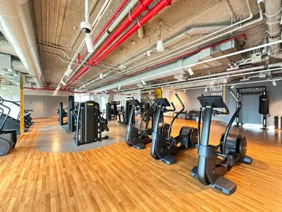 a gym with treadmills and elliptical machines at Burj Khalifa View From The Infinity Pool 2BR at Downtown Dubai in Dubai
