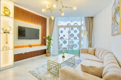 a living room with a couch and a table at PVH - Canal Frontage 1BR - Millennium Binghatti in Dubai