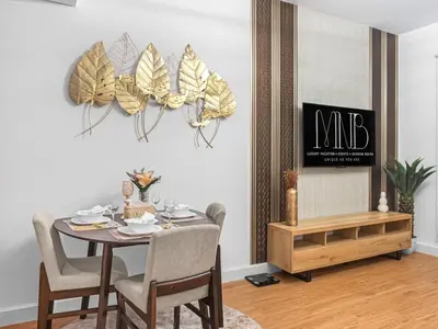 a dining room with a table and chairs at Cozy 1BR Downtown Burj View in Dubai
