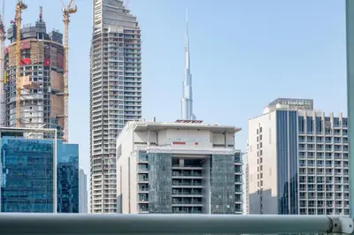 a group of tall buildings in a city at GuestReady - 1BR l Stylish City Escape in Dubai