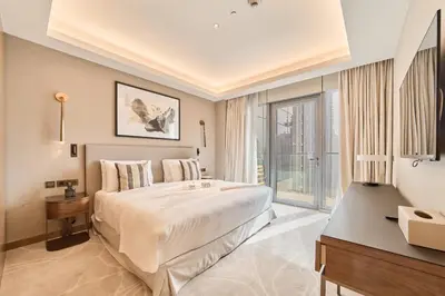 a hotel room with a large bed and a window at Premium 2BR Address Opera Downtown Dubai in Dubai