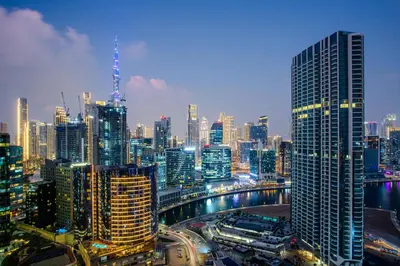 a view of a large city at night at Skyline Escape 2 bedroom with Burj Khalifa View in Dubai