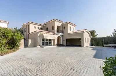 a large driveway in front of a house at Exclusive Golf Villa 5BR with Pool and Game Room in Dubai