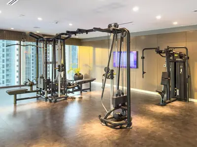 a gym with several exercise equipment in a building at Morden 2BR With Full sea view -High floor in Dubai