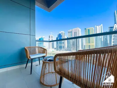 a room with a view of a city skyline at 1BR City Escape at Marina Residence Pool & Gym in Dubai