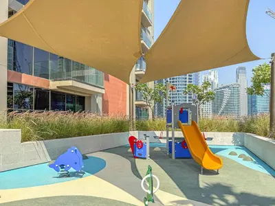 a childrens playground with a slide and a slidesktop at VayK - Bright Studio Overlooking The Canal in Business Bay in Dubai