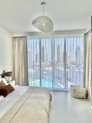 a bedroom with a large bed and a large window at Luxury 1Bed at LIV Marina Stunning Marina Views in Dubai