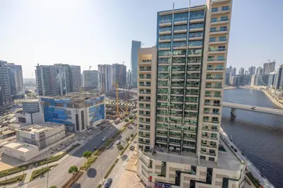 an aerial view of a city with tall buildings at Modern 1BR -Canal Views & Burj Views -Business Bay in Dubai