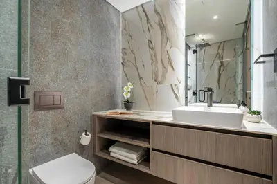 a bathroom with a sink and a toilet at Frank Porter - Grove by Eman in Dubai