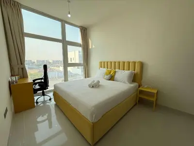 a bedroom with a bed with a stuffed animal on it at Spacious Fully Furnished 6BR Villa in Damac Hill2 in Dubai