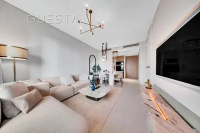 a living room with a couch and a table at Vida Residences Dubai Mall - Burj Khalifa View, Downtown Dubai in Dubai