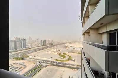 a view of a city street from a building at Peaceful 1BR with Balcony at Elite Residence Dubai in Dubai