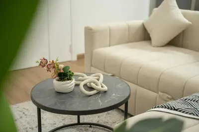 a living room with a coffee table and a couch at Luxury 2BHK with Floating Bed in Dubai Marina DEC1105 in Dubai