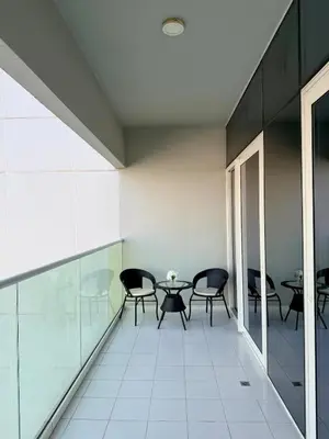 a room with chairs and a table in a building at Modern 1BR Apt - Canal View in Dubai
