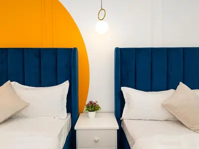 two beds sitting next to each other in a room at Luxury 3BHK w Floating Bed in Dubai Marina Man 2501 in Dubai