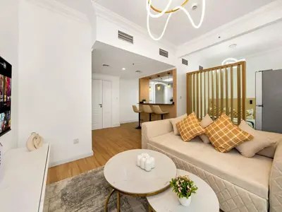a living room with a couch and a table at Luxury 3BHK w Floating Bed in Dubai Marina Man 2501 in Dubai