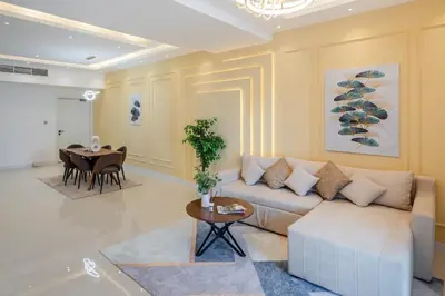 a living room with a couch and a table at Luxury 3 BR w Floating Bed in Dubai Marina DEC 902 in Dubai