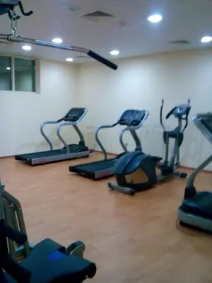 a gym with several exercise bikes in a room at Dubai Sports City home in Peaceful Location in Dubai