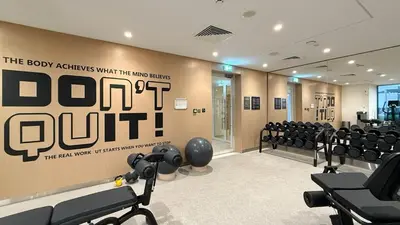 a gym with a bunch of equipment in a room at Luxury 3 Bedroom Apartment in Creek Harbour in Dubai