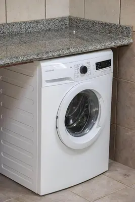 a white washer and dryer under a counter at Luxury 5BR Marina View w Private Pool KG1004 in Dubai