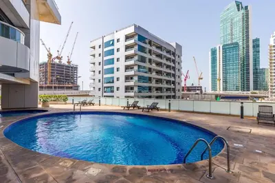 a large swimming pool on the roof of a building at Luxury 5BR Marina View w Private Pool KG1004 in Dubai