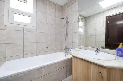 a bathroom with a bath tub and a sink at Luxury 5BR Marina View w Private Pool KG1004 in Dubai