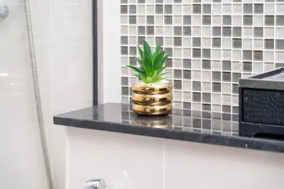 a pineapple sitting on a counter in a bathroom at Full Burj Khalifa View New Year Fireworks - DAMAC Maison Distinction in Dubai