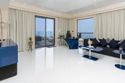 a living room with a couch and a table at Stunning VIP Penthouse JBR cinema&spa&pool in Dubai