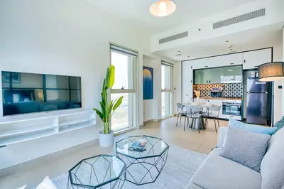 a living room with a couch and a table at PVH - Posh 2BR with 1 Queen Bed Plus 1 Single Bed - Collective 2-0 in Dubai
