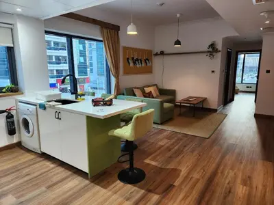 an open kitchen and living room with a couch at Modern 1BR Apartment - Marina Walk in Dubai