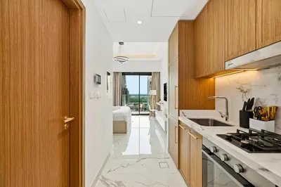 a kitchen with a sink and a stove at Estudio Coral en Dubai By BeBalmy in Dubai