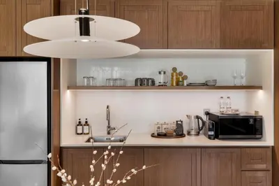 a kitchen with a counter with a microwave and a sink at Ultra Luxury Emaar Palace Beachfront 1BR Five Palm in Dubai