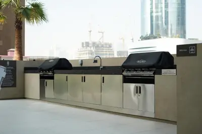 a kitchen with a counter with a sink and a stove at BRAND NEW FULL MARINA VIEW 1BR Apartment at LIV Marina in Dubai
