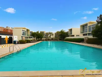a swimming pool at a resort with condos at Luxurious 3BR Villa Getaway in DH2 by Deleguest in Dubai