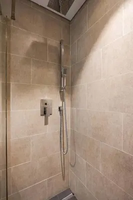 a shower in a bathroom with a glass door at Stunning I Biggest Studio I Near To Downtown in Dubai